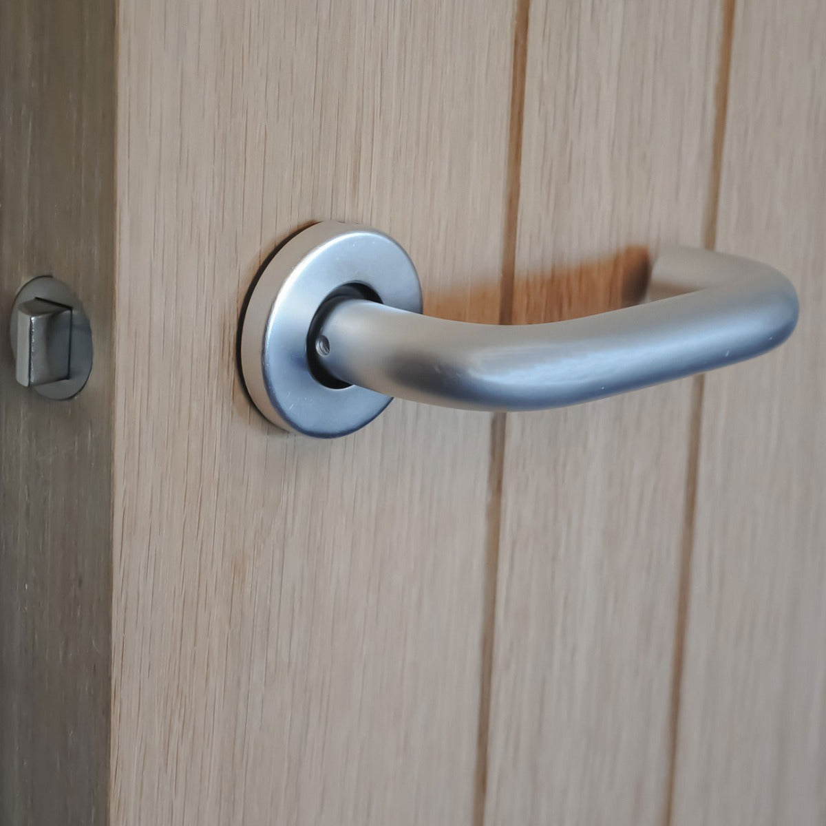 ViBE Round Bar Lever on Rose Door Handle in Satin Anodised Aluminium for Internal Doors