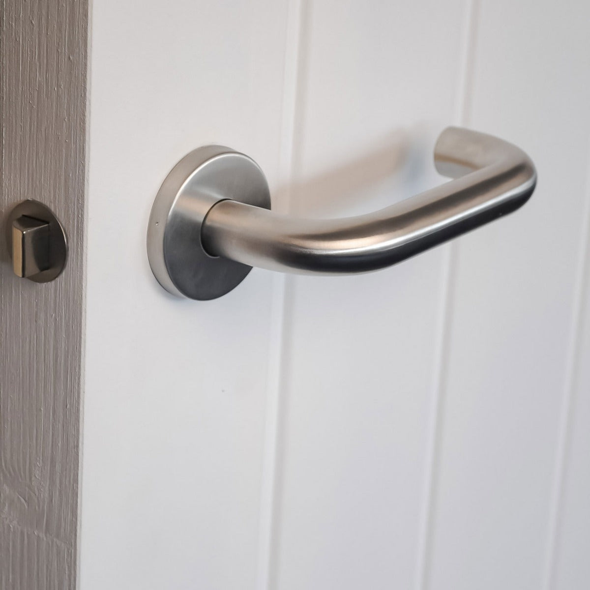 ViBE Runda Lever on Rose Door Handle in Satin Stainless Steel for Internal Doors