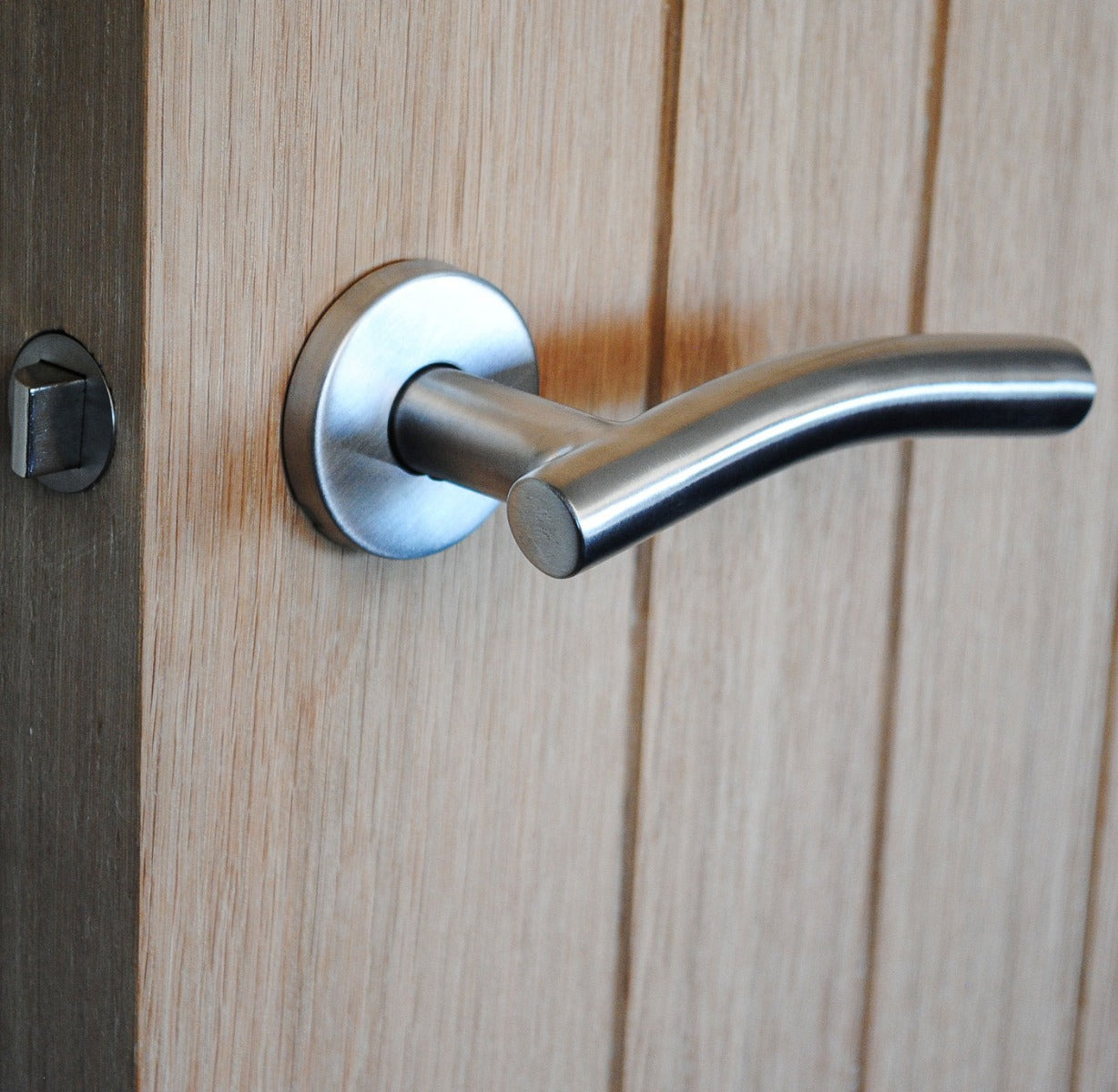 ViBE Curve Lever on Rose Door Handle in Satin Stainless Steel for Internal Doors