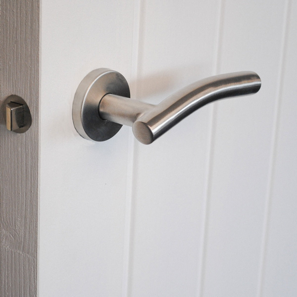 ViBE Curve Lever on Rose Door Handle in Satin Stainless Steel for Internal Doors