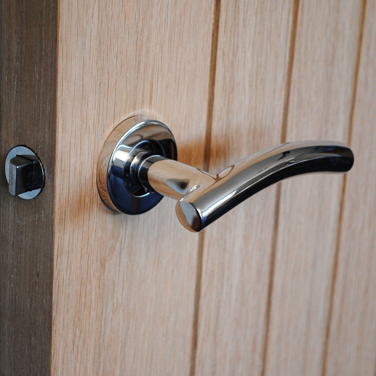 ViBE Curve Lever on Rose Door Handle in Polished Stainless Steel for Internal Doors