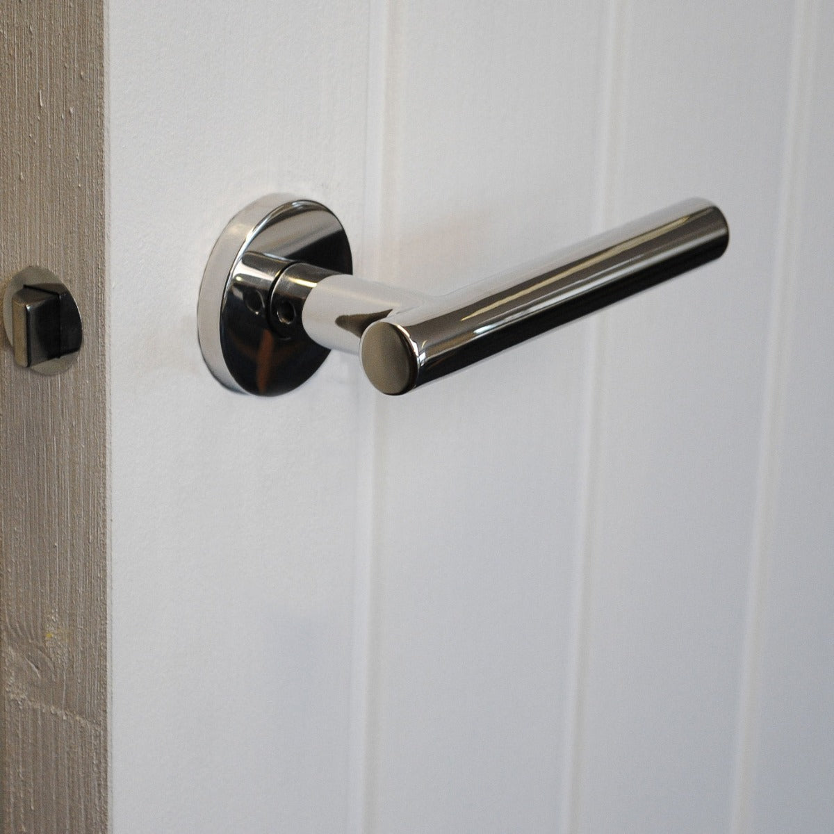 ViBE Horna Lever on Rose Door Handle in Polished Stainless Steel for Internal Doors