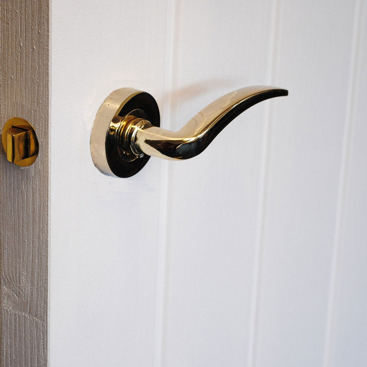 ViBE Corsica Lever on Rose Door Handle in Polished Brass for Internal Doors