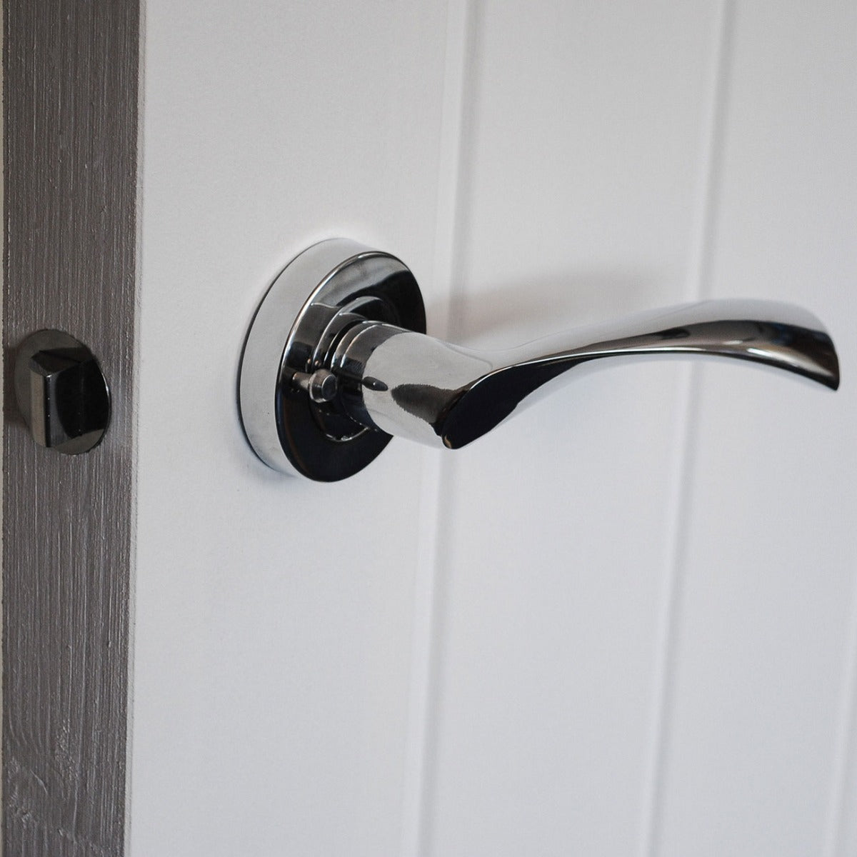 VIBE Design Push Button Privacy Twirl Lever in Polished Chrome for Bathroom Doors