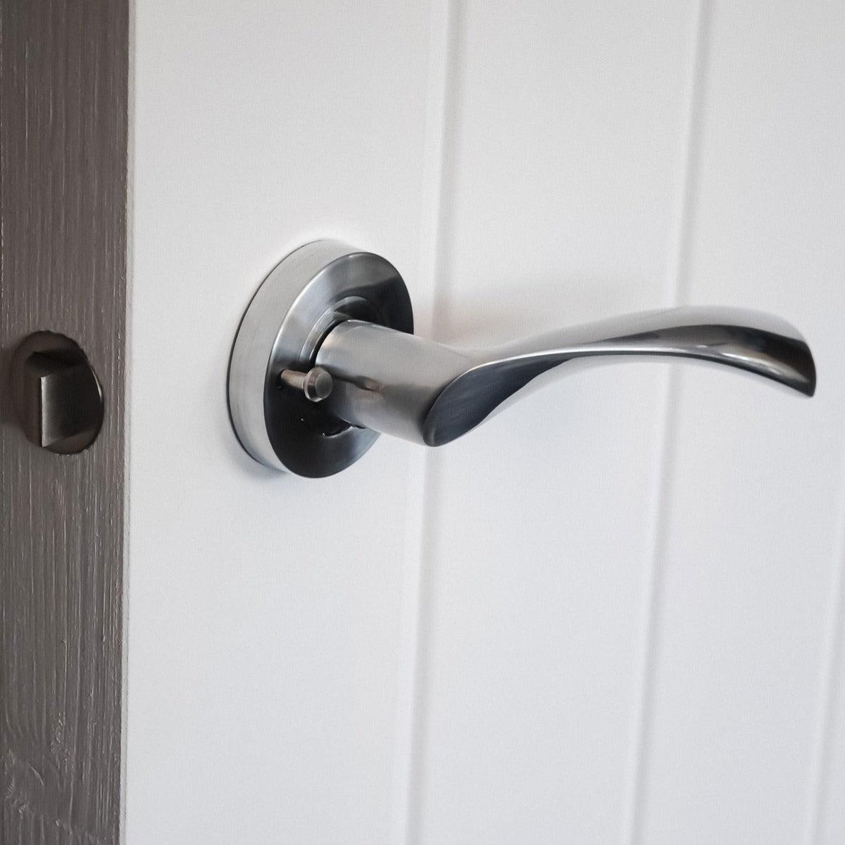 VIBE Design Push Button Privacy Twirl Lever in Satin Chrome for Bathroom Doors